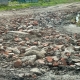 Камни «проткновения»: грунтовую дорогу в Омской области укрепили до скрежета
